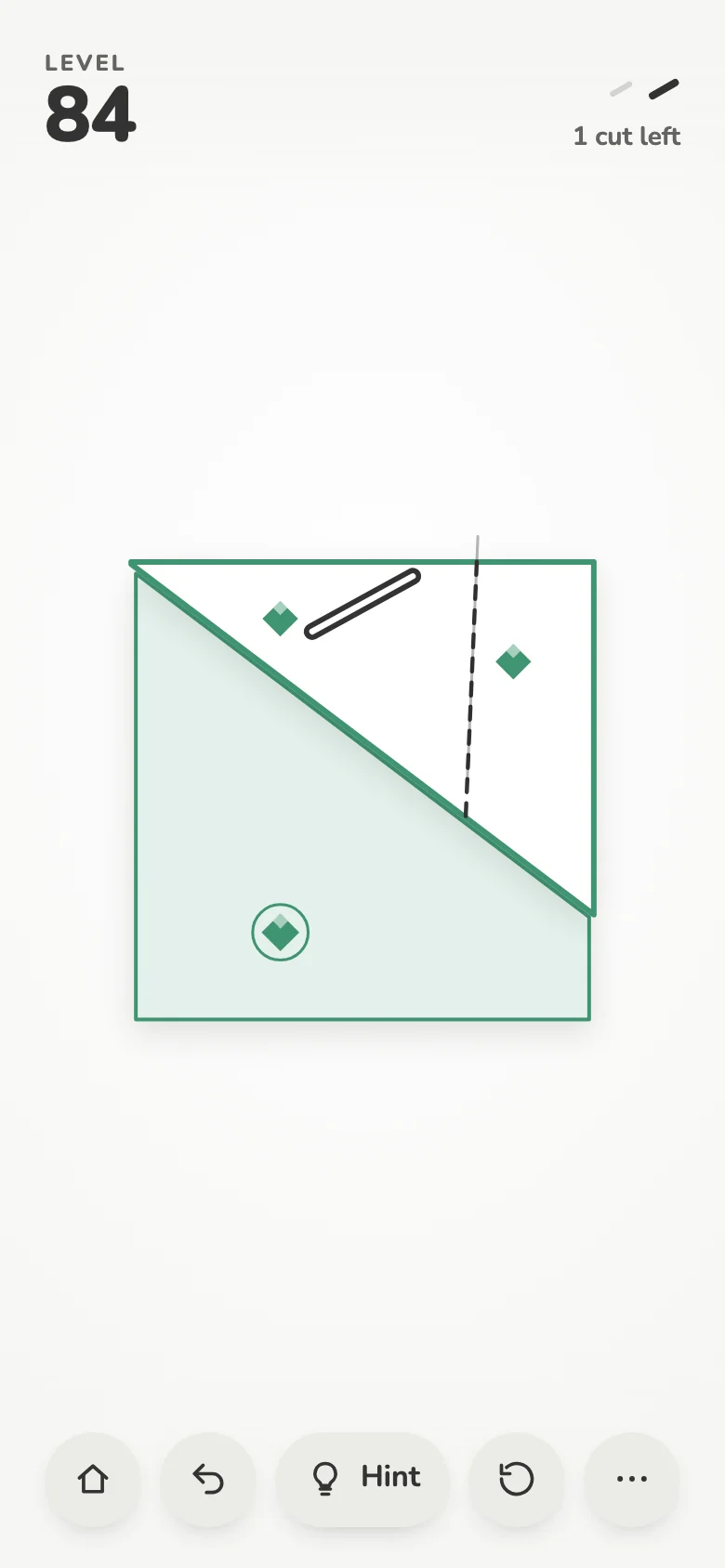 A cut being previewed: a dashed line across a shape with green gems and a steel bar.